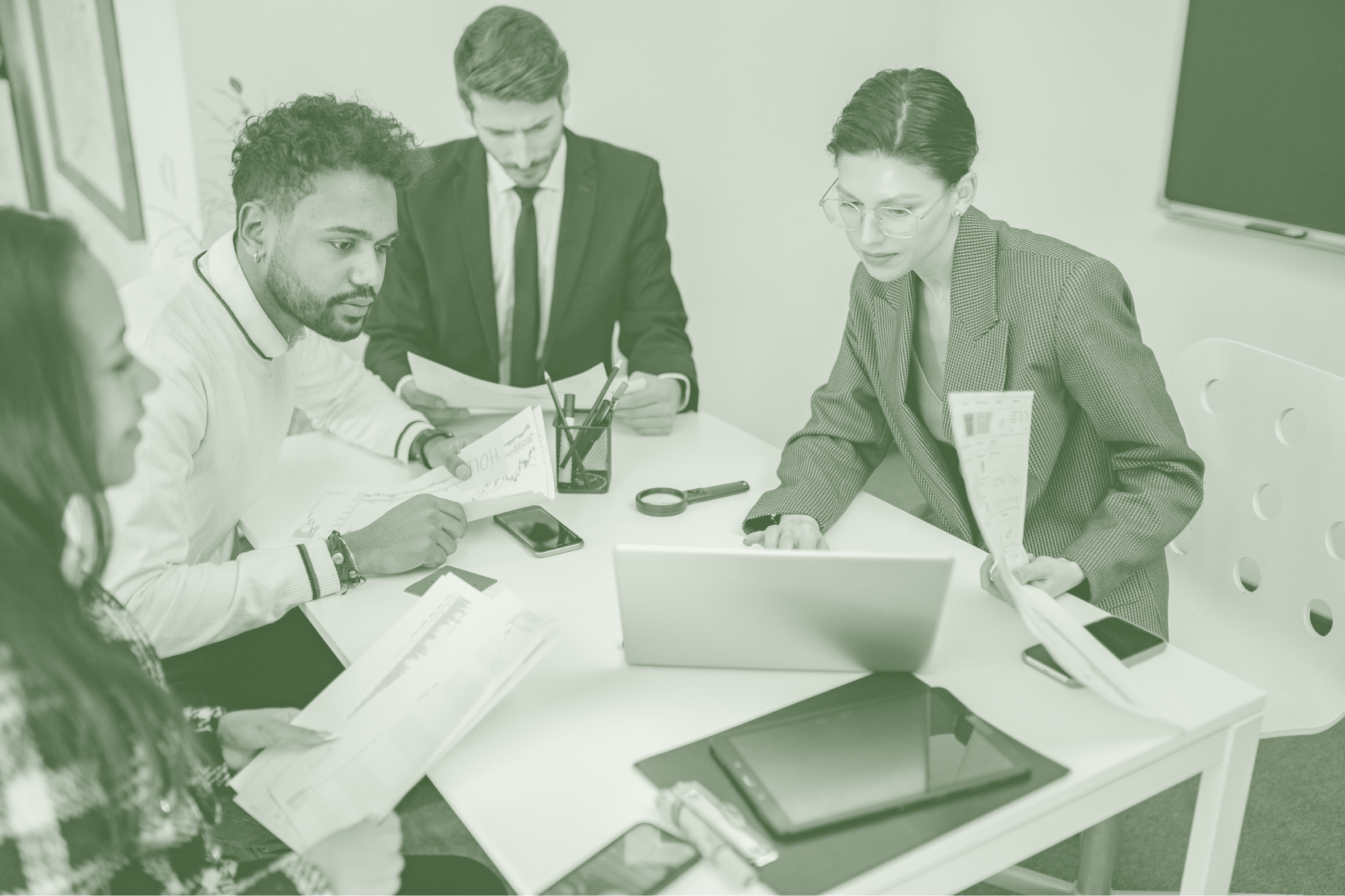 Business professionals reviewing acquisition and corporate finance opportunities and business loans