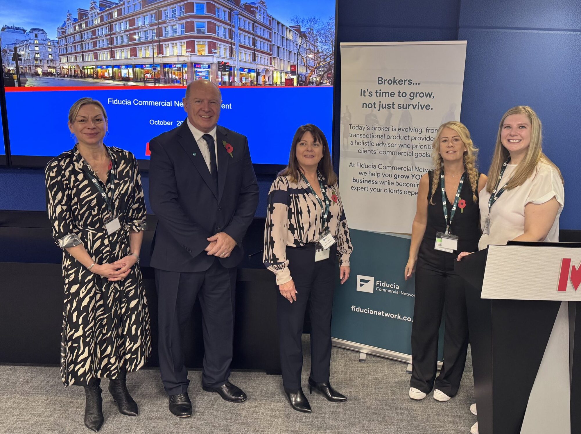 Fiducia Commercial Network team members and commercial finance professionals at an FCN broker event discussing industry insights and commercial finance opportunities.